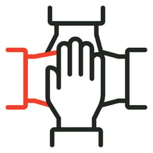 Hands in a huddle with one highlighted red